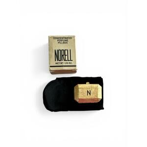 Vintage Norell Concentrated Solid Perfume Pillbox and its original packaging.